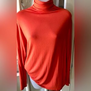 Women’s bright tangerine long sleeve lightweight turtleneck blouse in size 1X
